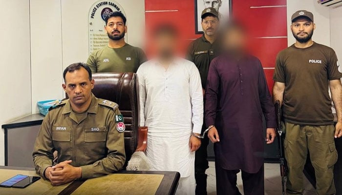 Police personnel pictured with the arrested suspects on June 1, 2026. — Facebook@LahorePoliceOperationsWing