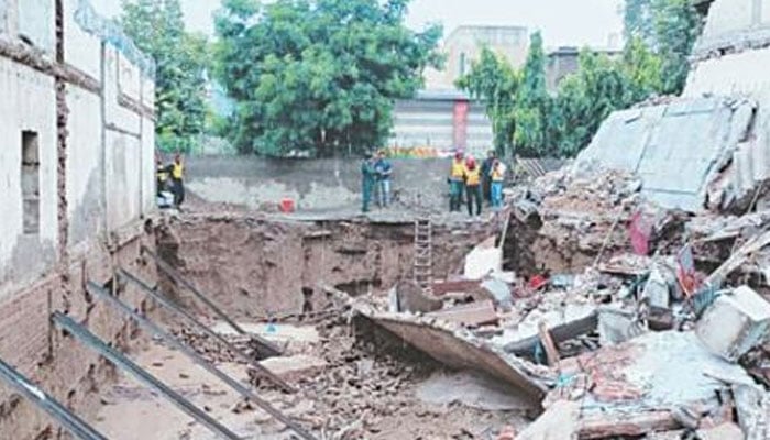 This representational image shows a collapsed wall. — APP/File
