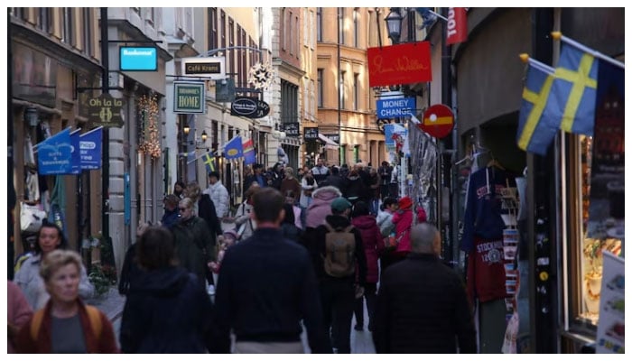 Pedestrians walk along a street in the Old Town of Stockholm, Sweden, October 17, 2024. —Reuters