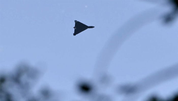 A Russian drone flies above Kyiv during an attack on May 24. —AFP