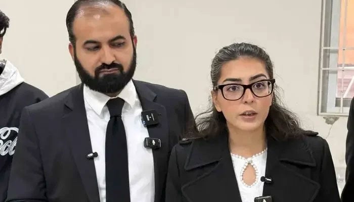 This picture taken on December 5, 2025 shows human rights lawyer Imaan Mazari (R) with her husband and fellow lawyer Hadi Ali Chattha (L), during a court hearing in Islamabad. — AFP