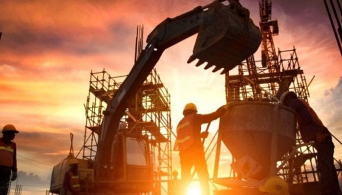 This representational image shows two labourers working on a development project. — Reuters/File