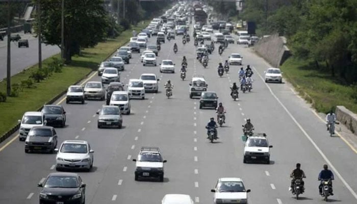 Representational image shows commuters on a road. — AFP/ File