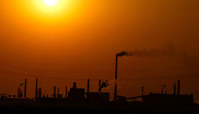 Factories are silhouetted during sunset, in Handan, Hebei province, China, April 7, 2026.—Reuters