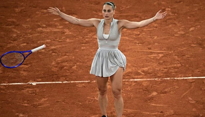 Marta Kostyuk can be seen celebrating. —AFP/File