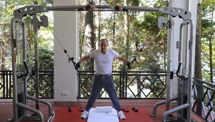 Russian President Vladimir Putin exercises in a gym at the Bocharov Ruchei state residence in Sochi, Russia, August 30, 2015.—Reuters