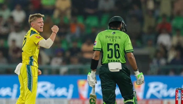 Australias Nathan Ellis (left) celebrates dismissing Pakistans Babar Azam during their second ODI at the Gaddafi Stadium in Lahore on June 2, 2026. — PCB