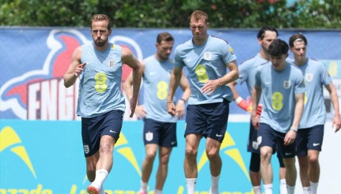 England captain Harry Kane (left) leads his team-mates in their opening pre-World Cup training session in Florida. —AFP