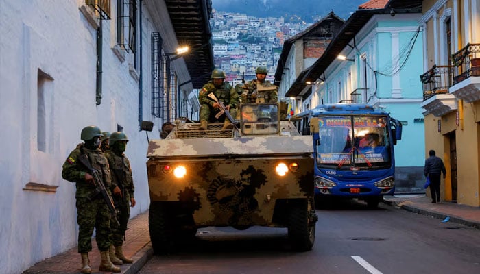 Soldiers in an armored vehicle patrol the citys historic center following an outbreak of violence a day after Ecuadors President Daniel Noboa declared a 60-day state of emergency following the disappearance of Adolfo Macias, leader of the Los Choneros criminal gang from the prison where he was serving a 34-year sentence, in Quito, Ecuador, January 9, 2024.—Reuters