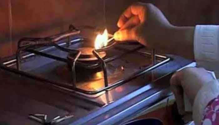 A woman is seen lighting the gas stove. — The News/File