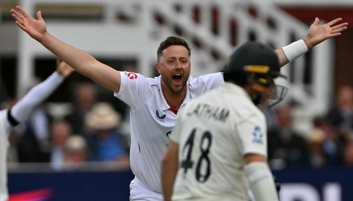Ollie Robinson can be seen celebrating. —AFP/File