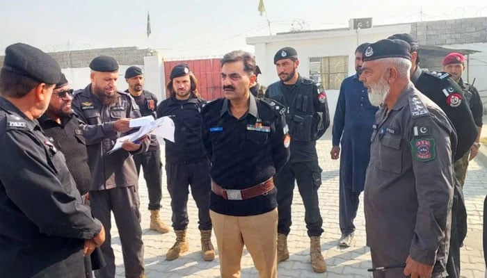 Khyber District Police Officer (DPO) Waqar Ahmad (centre) interacts with police personnel on December 11, 2025. — Facebook@khyberpoliceofficial