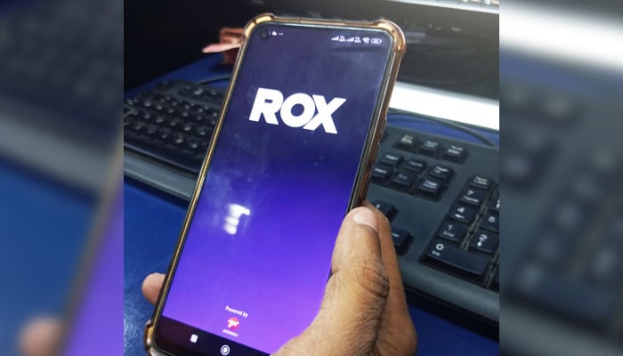 This image, taken on June 5, 2026, shows a user opening a digital application ROX on his mobile phone in Karachi. — Geo.tv