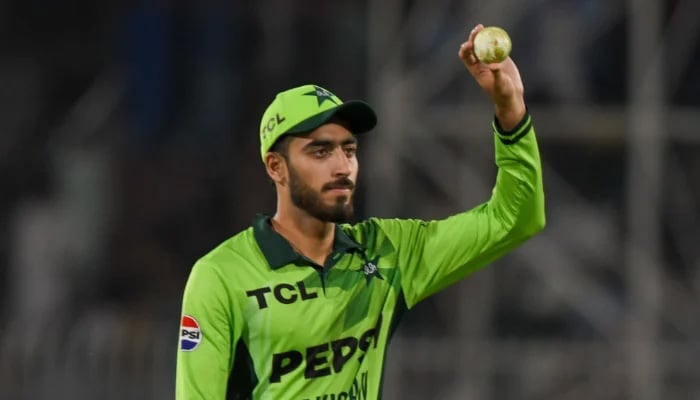 Pakistan spinner Arafat Minhas raises the ball after taking a five-wicket haul during the first ODI against Australia at the Rawalpindi Cricket Stadium in Rawalpindi on May 30, 2026. — PCB