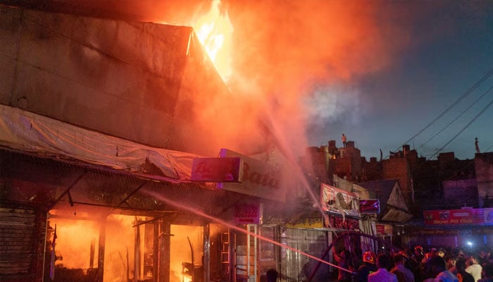 Representational image shows firefighters working after a fire broke out at a market. —Reuters/File