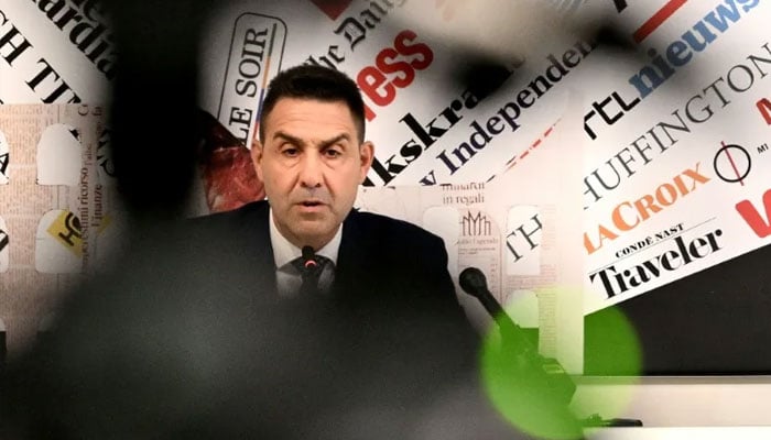 Roberto Vannacci can be seen talking to the media. —AFP/File