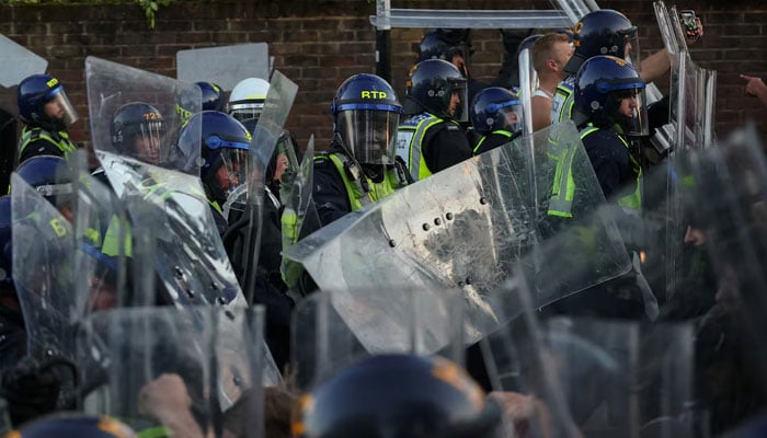 Protesters clash with police officers during a demonstration following the conviction of Vikrum Digwa for the murder of student Henry Nowak, in Southampton, Britain, June 2, 2026.—Reuters