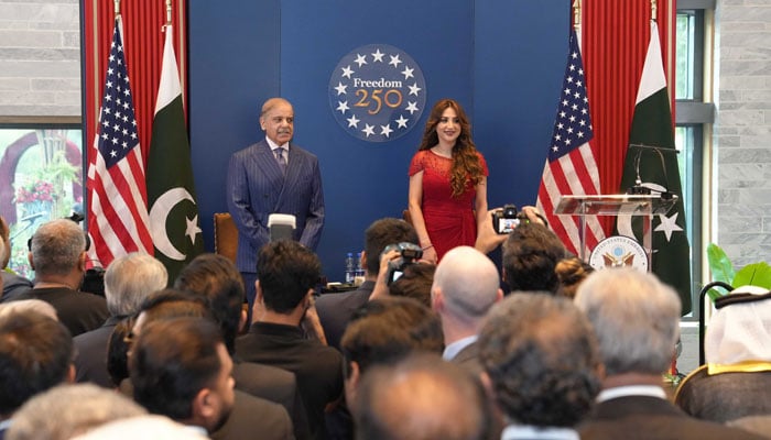 Prime Minister Shehbaz Sharif and US Charge dAffaires Natalie A Baker stand together during the celebration of the 250th anniversary of American independence, symbolising Pakistan–US diplomatic ties and cooperation. — X/@usembislamabad/File
