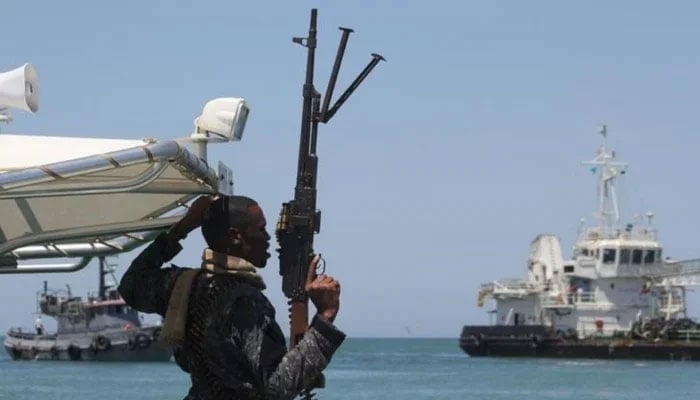 A maritime policeman on a tag-boat guards oil tanker Aris-13, which was released by pirates, as it sails to dock on the shores of the Gulf of Aden in the city of Bosasso, northern Somalias semi-autonomous region of Puntland, March 19, 2017. — Reuters