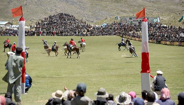 Polo players in action during a freestyle match at the worlds highest polo ground at the annual Shandur Polo Festival on June 20, 2025. — APP