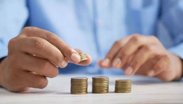 Representational image of a person sorting coins. — Unsplash/File
