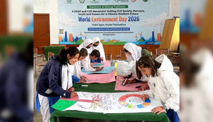 Students prepare drawings and paintings on environmental themes in Upper Chitral. —  APP/File