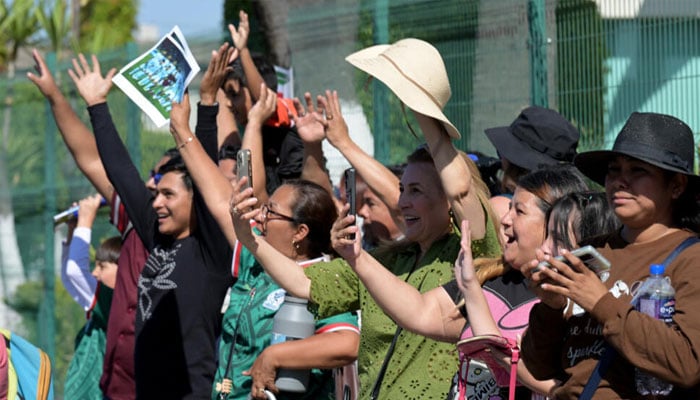 Mexican supporters welcoming the Iranian football team. —AFP