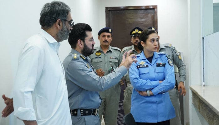 Islamabad Chief Traffic Officer (CTO) Sarfaraz Virk and SP Kainat Azhar Khan visit Police Khidmat Markaz H-11 on June 11, 2026. — Facebook@islamabadpolice