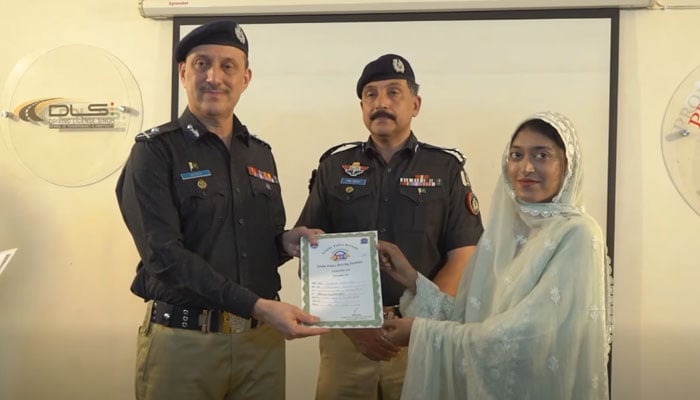 Karachi police chief, Additional IG Azad Khan, distributes certificates among women who completed the training program during a visit to the Traffic Police Driving Training School in Saeedabad on June 11, 2026. — Screengrab via Facebook@sindhpolicedmc