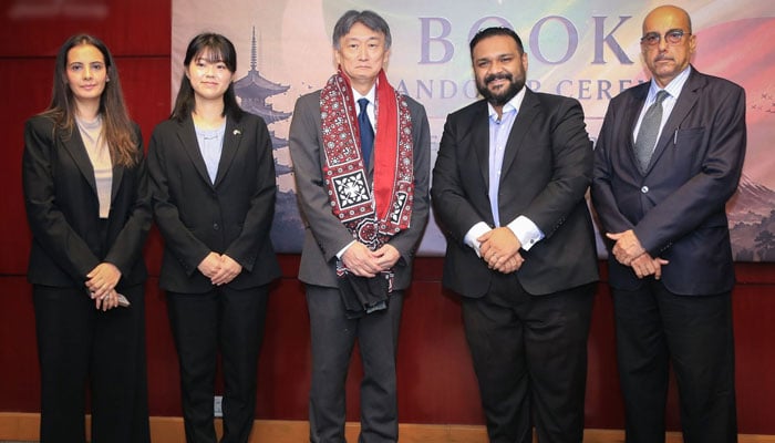 Consul General of Japan in Karachi, Hattori Masaru (centre), pictured with others at a book handover ceremony at Greenwich University on June 10, 2026. — Facebook@GreenwichUniversity