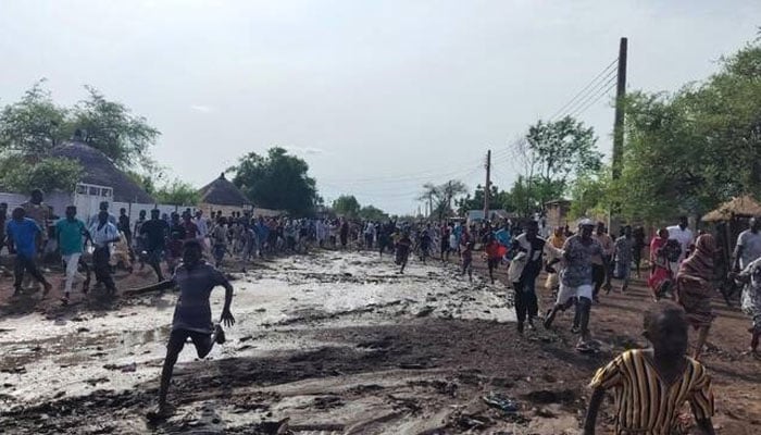 Sudanese run after hearing the noise of an explosion, reportedly from a drone that crashed, near the local government headquarters, in the Friendship neighbourhood of the city of Gedaref, eastern Sudan. —AFP/File