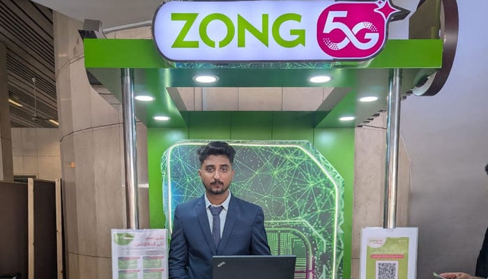 A Zong representative posing for the photo at a stall in the airport. —Zong website