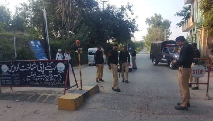 The Azad Jammu and Kashmir police are standing on a checkpost. —Facebook/AJK police/File
