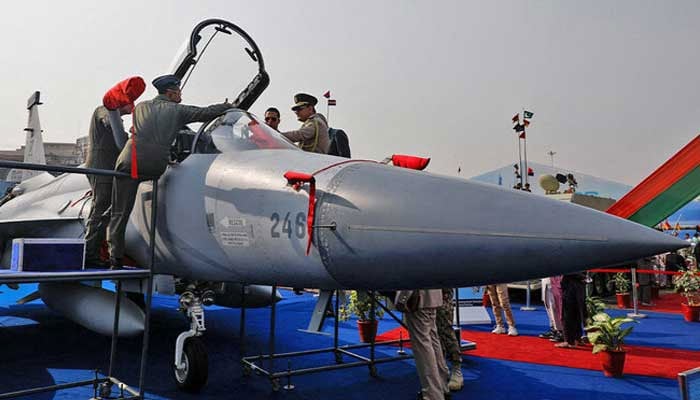 Officials inspect cockpit of a JF17 Thunder fighter jet during International Defense Exhibition and Seminar Ideas 2022 in Karachi, November 16, 2022. — Reuters/File