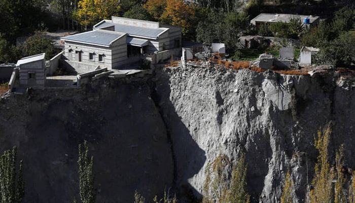 A community hall and houses show signs of damage after a Glacial Lake Outburst Flooding (GLOF) incident occurred from the nearby Shisper glacier, in Hassanabad village, Hunza valley, in the Karakoram mountain range in the Gilgit-Baltistan region of Pakistan, October 10, 2023. — Reuters