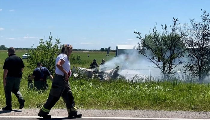 Firefighters work on the site of an aircraft crash in Butler, Missouri, in this still image taken from a video.—Reuters