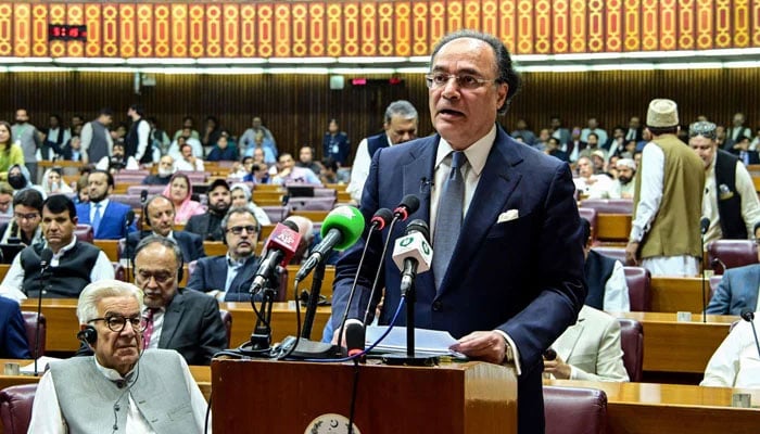This handout photograph, taken on June 12, 2026 and released by Pakistans National Assembly, shows Finance Minister Muhammad Aurangzeb presenting the 2026- 27 fiscal budget at the Parliament House in Islamabad. — AFP