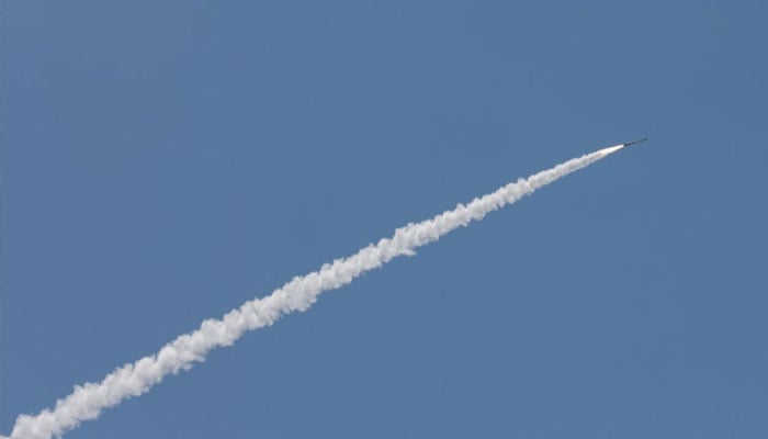 This picture taken from a position in the Upper Galilee region in northern Israel shows an Israeli Iron Dome missile streaking across the sky to intercept incoming projectiles, June 8, 2026. —AFP