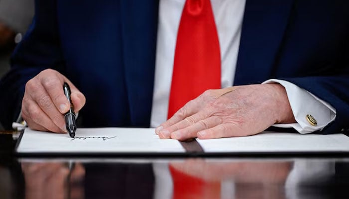 US President Donald Trump signs a proclamation for restoring American commercial fishing in the Pacific, in the Oval Office at the White House in Washington, DC, US, June 11, 2026. —Reuters