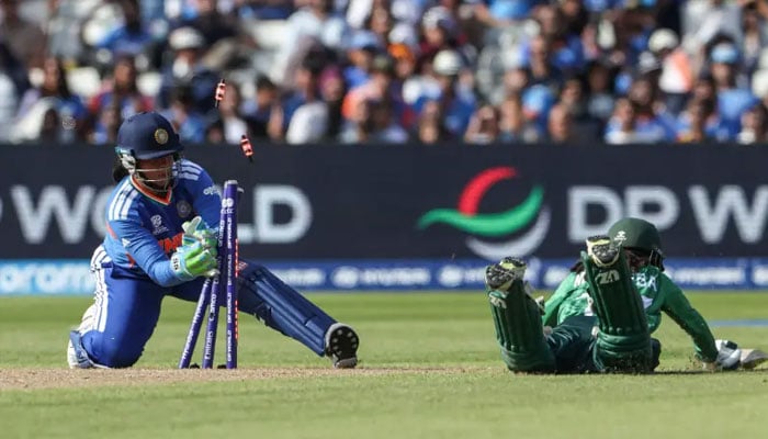 Indias Richa Ghosh (left) tries to run out Pakistans Muneeba Ali (right) during the ICC Womens T20 cricket World Cup 2026 Group A stage, Match 6 match between India and Pakistan at Edgbaston cricket ground in Birmingham, central England on June 14, 2026. — AFP