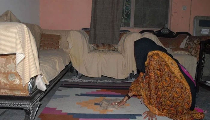 A representational image of a domestic worker busy in household chores. — The News/File
