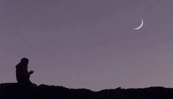 An undated image of a person praying after sighting the moon. — AFP/File