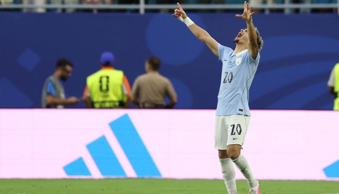 Uruguays Maxi Araujo celebrates equalising in a 1-1 draw with Saudi Arabia in World Cup Group H. —AFP