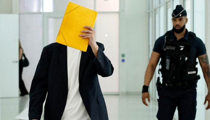 The defendant, a 36-year-old freelance journalist who worked in a kindergarten to help make ends meet, denies the accusations. — AFP
