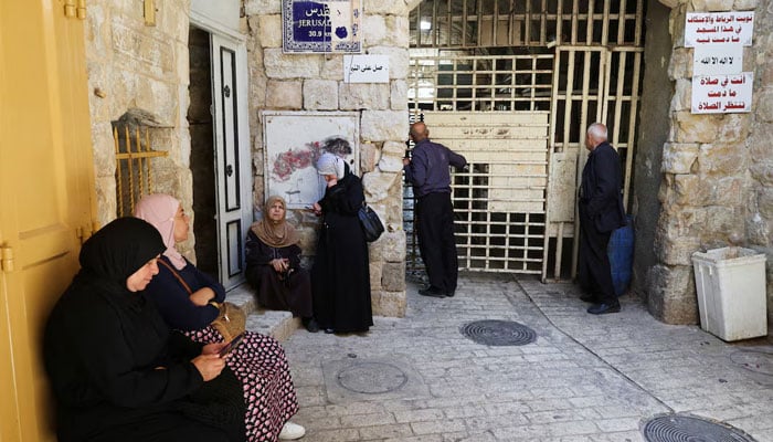 Palestinians wait to enter the Ibrahimi Mosque, also known as the Cave of Patriarchs, in the old city of Hebron, in the Israeli-occupied West Bank, June 17, 2026.—Reuters
