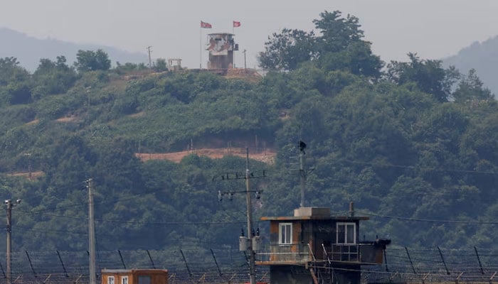A North Korean soldier stands guard at his guard post inside North Korean territory, in this picture taken from Paju, South Korea, near the demilitarized zone (DMZ) separating the two Koreas, June 17, 2020.—Reuters