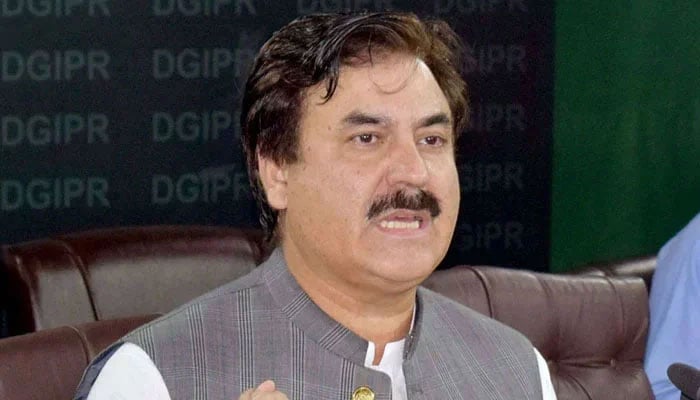 Former minister and Pakistan Tehreek-e-Insaf leader Shaukat Yousafzai speaks to someone. — APP/File