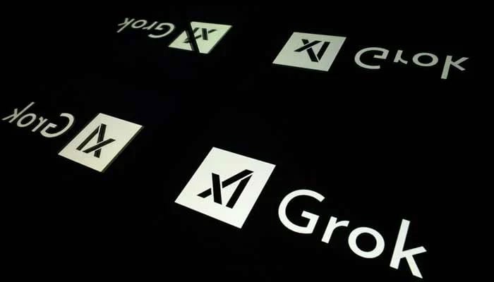 This photograph shows screens displaying the logo of Grok, a generative artificial intelligence chatbot developed by US artificial intelligence company xAI. — AFP/File