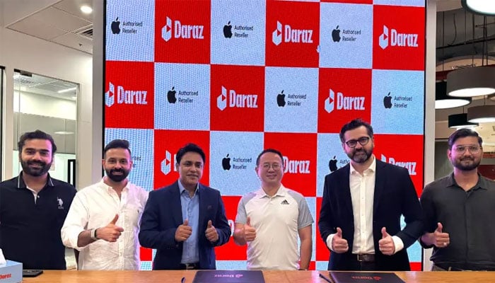 Darazs Chief Commercial Officer Ben Yi, GNext CEO Muhammad Shahid, and others pose for a photo at the launch ceremony of the Apple Flagship Store on Daraz Pakistan in Karachi on June 18, 2026. — Daraz Pakistan