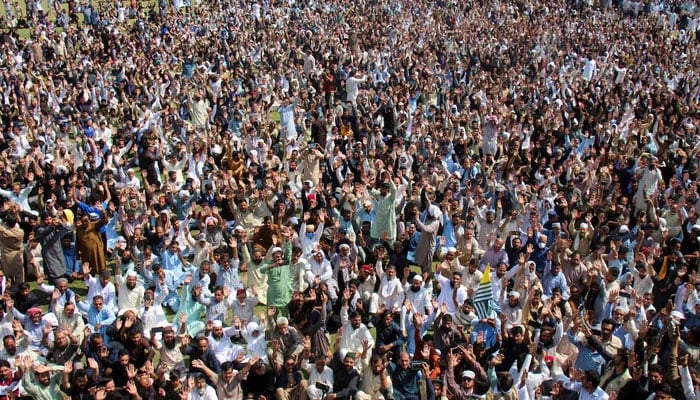 Supporters of the Joint Awami Action Committee (JAAC) chant slogans following a shutter-down strike in Muzaffarabad on October 2, 2025. — Reuters